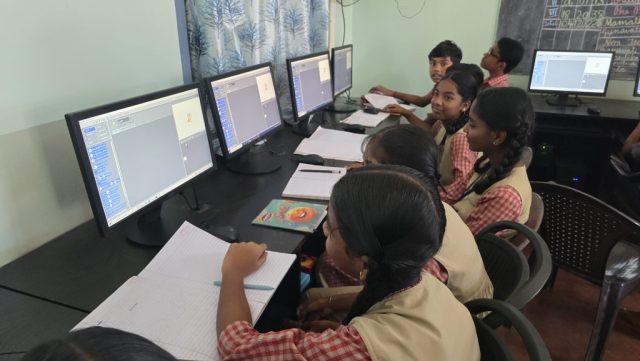 Students doing Scratch Programming