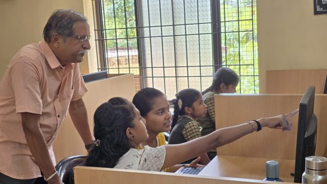 Pavanaja helping students